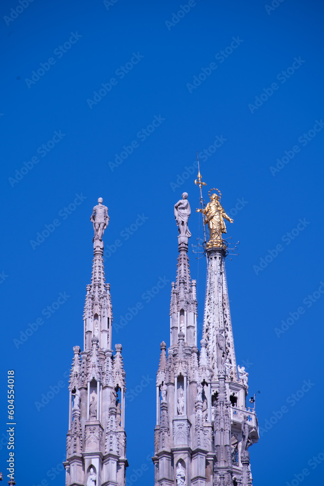 Daytime view of famous Milan Cathedral (Duomo di Milano) on piazza in Milan, Italy Daytime view of famous Milan Cathedral (Duomo di Milano) on piazza in Milan, Italy