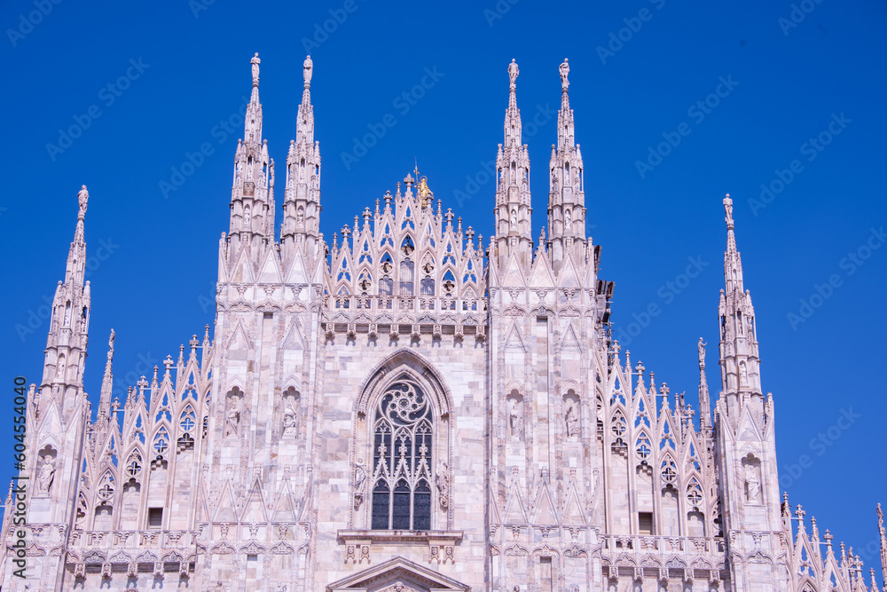 Daytime view of famous Milan Cathedral (Duomo di Milano) on piazza in Milan, Italy
