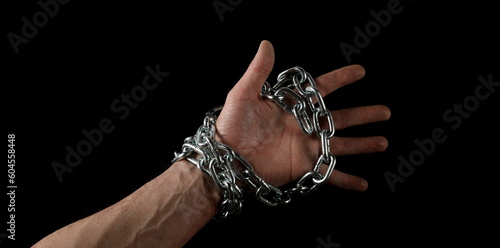 Hands in chains isolated on black, clipping path