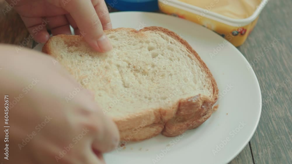 Making double butter and peanut butter toast. Close up. Making double butter and peanut butter toast. Close up.