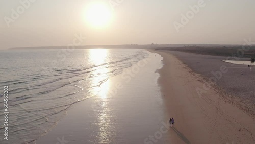 Aerial panoramic sunset seascape view of Salgados beach in Albufeira, at Algarve region, a Worldwide Popular Beach and Nature Destination, in South Portugal.