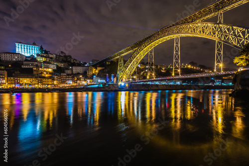 Fototapeta Naklejka Na Ścianę i Meble -  Evenieng view of Porto city, Portugal. View from river bank in Vila Nova de Gaia city