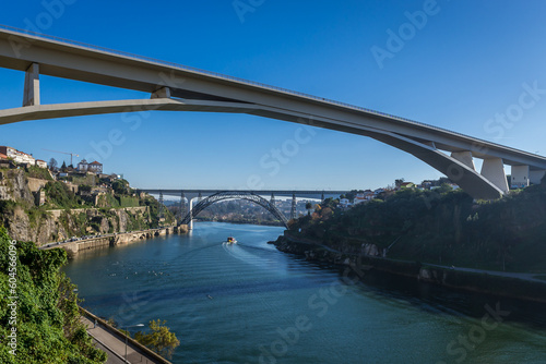 View on three bridges connecting Porto and Vila Nova de Gaia: Infante D. Henrique Bridge and railway bridges Maria Pia and Saint John bridge, Portugal