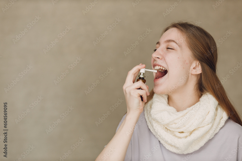 Young woman has flu catarrh ill sick disease treatment cold hold medicine nasal spray Young woman has flu catarrh ill sick disease treatment cold hold medicine nasal spray