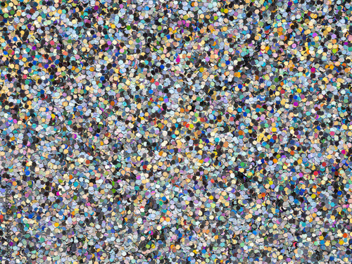 Fancy rainbow color glitter sparkle confetti background for happy birthday party invite card.