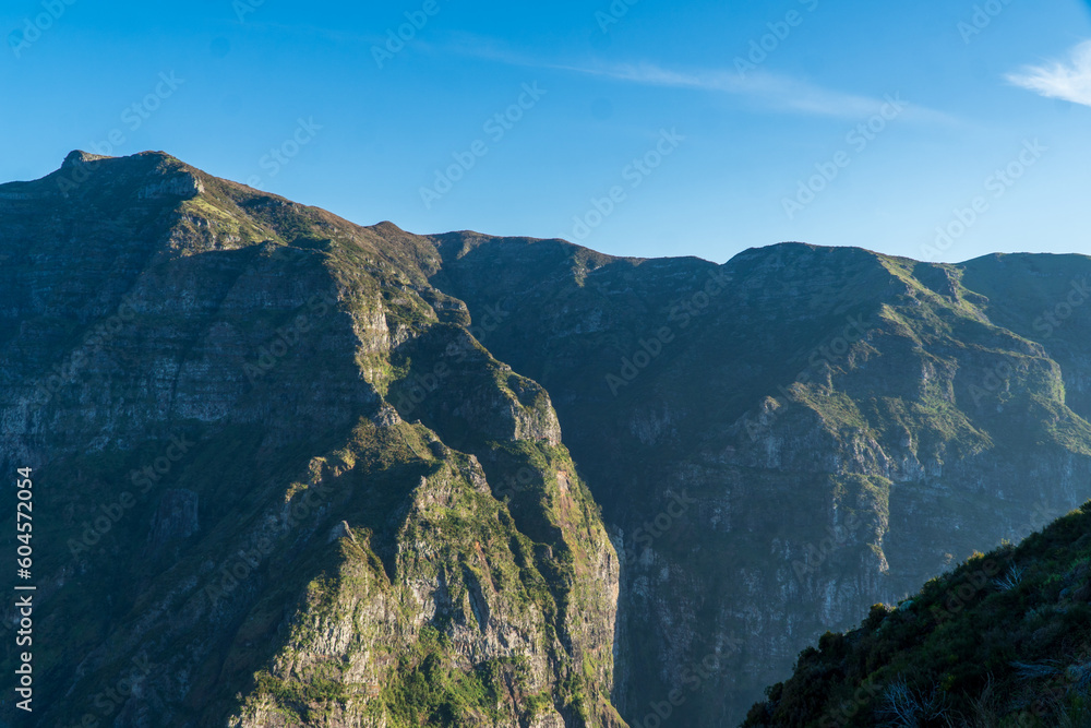 Fototapeta premium Mountain landscape. View of mountains on the route Queimadas Forestry Park - Caldeirao Verde. Madeira Island, Portugal, Europe.