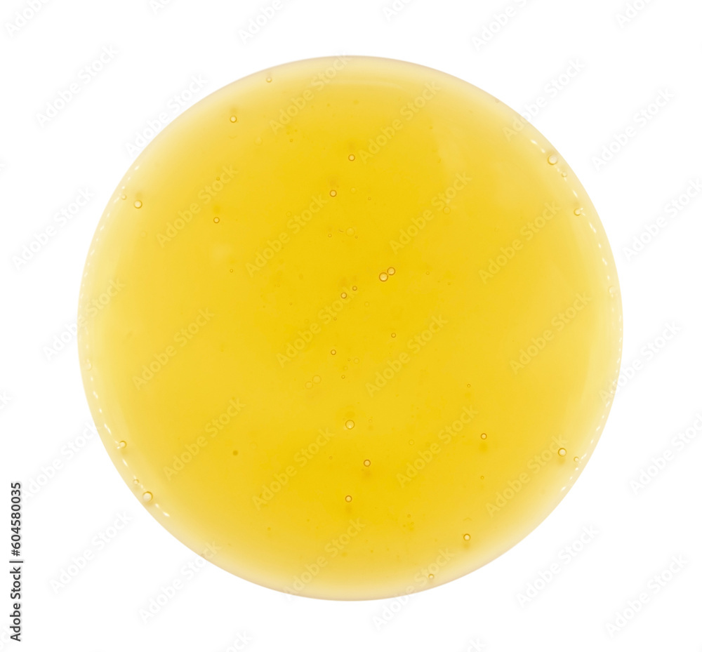 A drop of oil or shampoo with small yellow bubbles on a white background. Detergent. Liquid soap