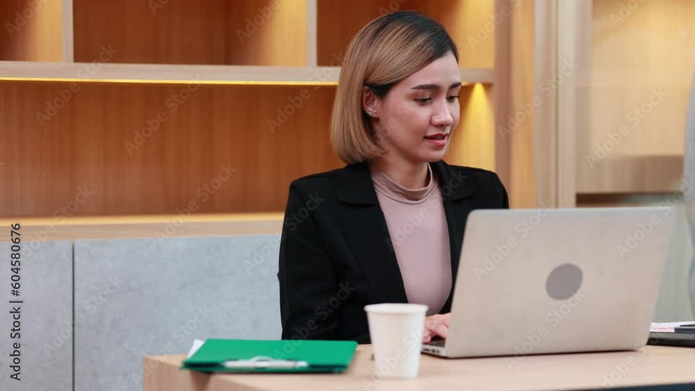 Secretary female. Asian business working woman work online job on laptop computer at smallbusiness home office. Work from home Secretary female. Asian business working woman work online job on laptop computer at smallbusiness home office. Work from home