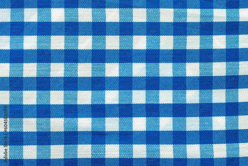 Φωτογραφία The texture of linen fabric in a large cage of blue and white