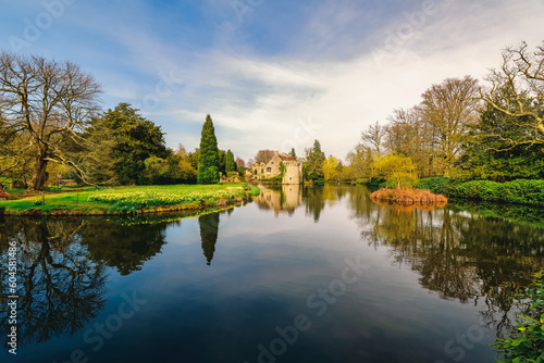 romantic ruined castle at a lake with reflections