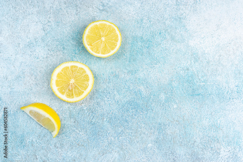 Fresh slices of lemons on bright background. Lemon fruit citrus. Summer theme, healthy fruit.