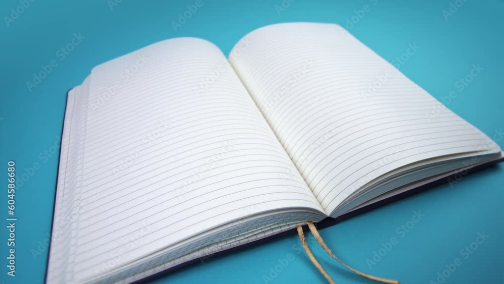 open notepad with empty pages on light blue background close open notepad with empty pages on light blue background close