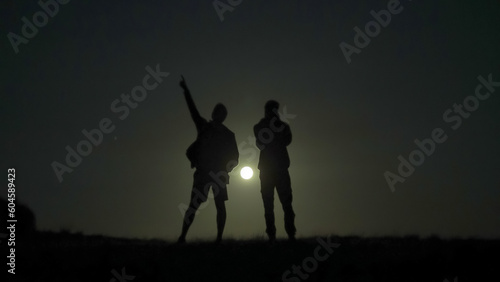 Father and son looking at the stars