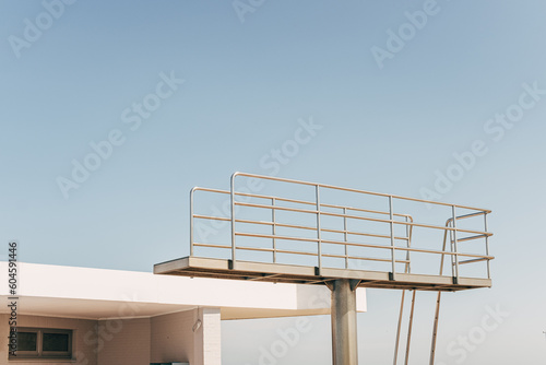 part of diving tower in front of blue sky