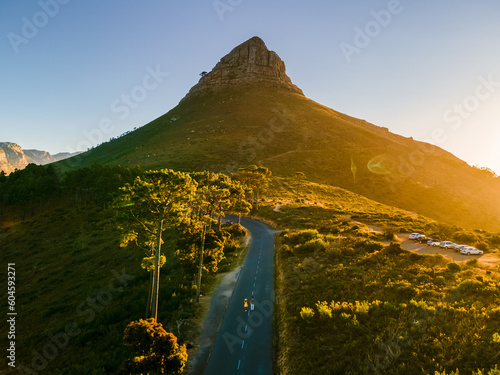 A couple of men and women watching the sunset at Lion's Head near Table Mountain Cape Town South Africa photo