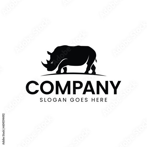 Vector illustration of a silhouette of a rhino standing on isolated white background