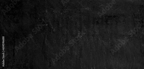 Black speckled hand-painted illustration texture design of old distressed vintage grunge concrete with gray stains. damaged textured abstract washed cement backdrop as web banner background.