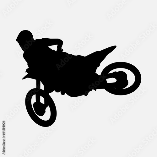 silhouette of a motocross racer doing a stunt, jumping. isolated on white background. graphic vector illustration.