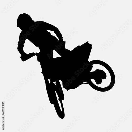 silhouette of a motocross racer doing a stunt, jumping. isolated on white background. graphic vector illustration.