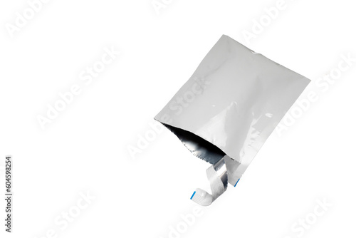Open white sachet, ripped disposable blank sachet packaging photo