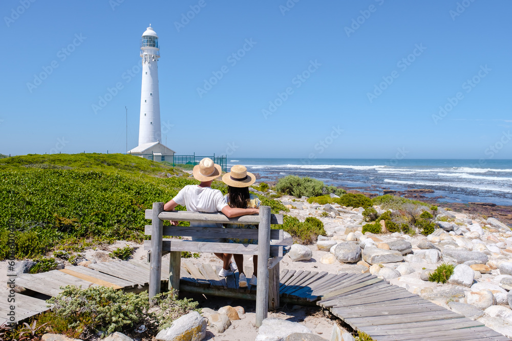 Φωτογραφία Couple men and women visiting the lighthouse of Slangkop Kommetjie Cape Town South Africa, The Slangkop lighthouse in the village of Kommetjie on the Cape Town Peninsula