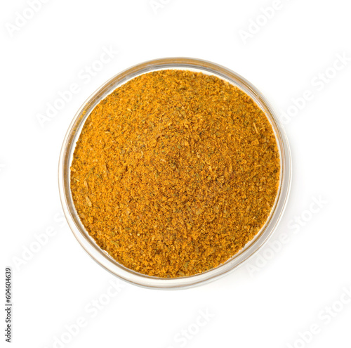 Glass bowl with curry powder isolated on white, top view