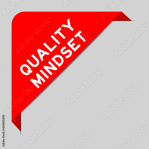 Red color of corner label banner with word quality mindset on gray background