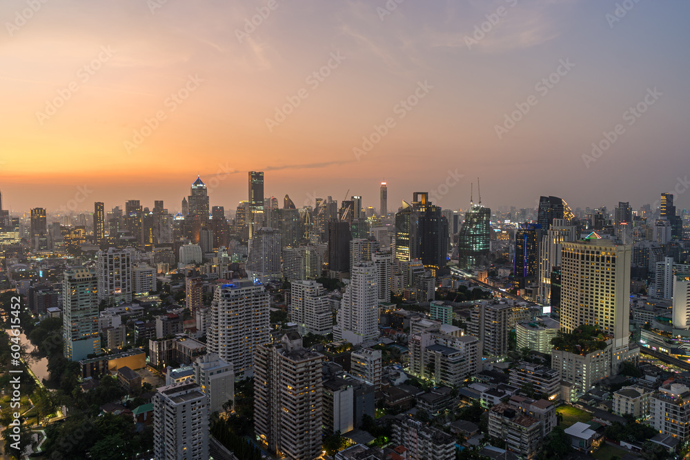 Scenery cityscape of Illuminated Bangkok city metropolis in twilight. Panoramic skyline urban panorama of modern city on dusk. High-angle view