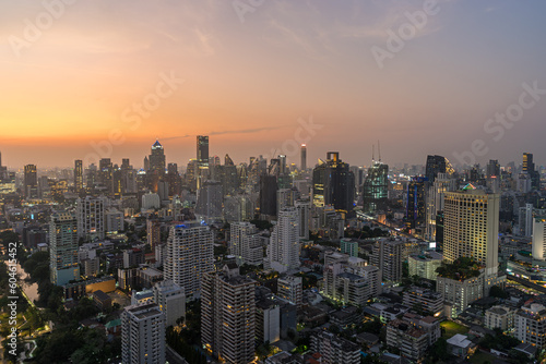Scenery cityscape of Illuminated Bangkok city metropolis in twilight. Panoramic skyline urban panorama of modern city on dusk. High-angle view © evgenydrablenkov