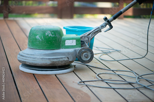 Wooden terrace floor restoration. Cleaning dust after sanding.