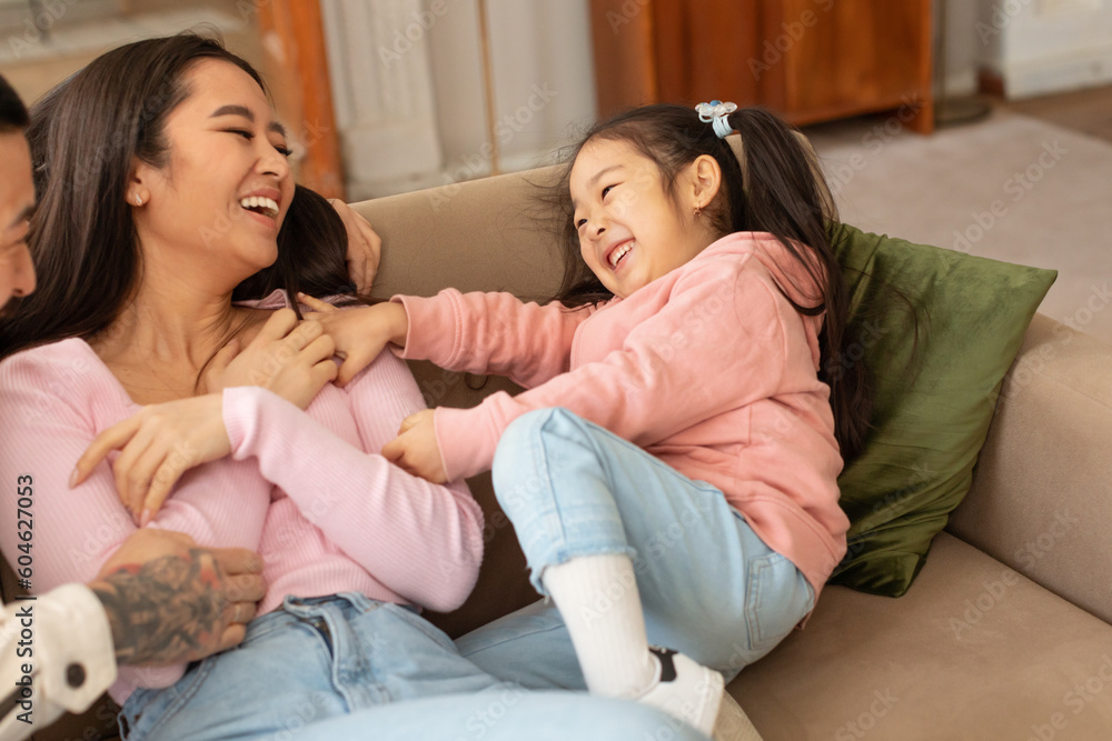 Asian Baby Daughter Tickling Mommy Having Playtime With Parents Indoors Asian Baby Daughter Tickling Mommy Having Playtime With Parents Indoors