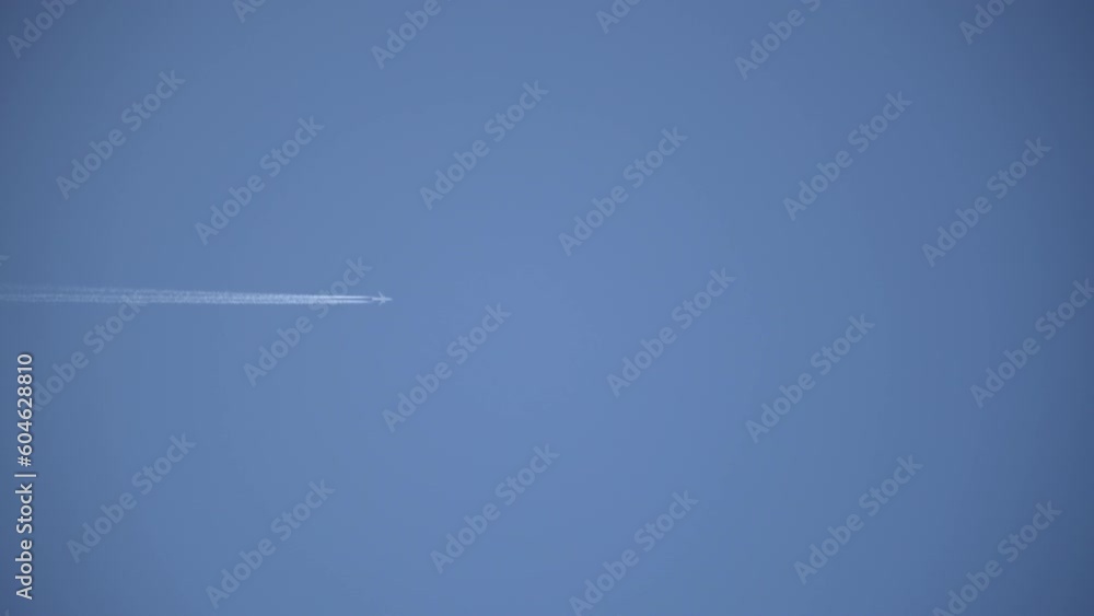 The plane leaves a trail of smoke in the sky The plane leaves a trail of smoke in the sky