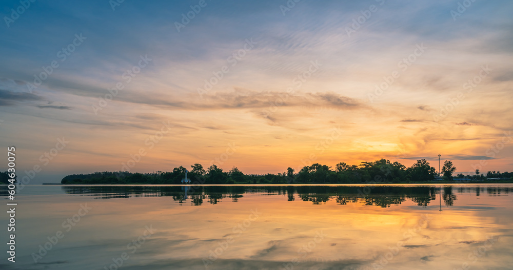 Sunset sky clouds in the morning with orange sunrise sky and reflection on river, Majestic summer horizon view landscape countryside   