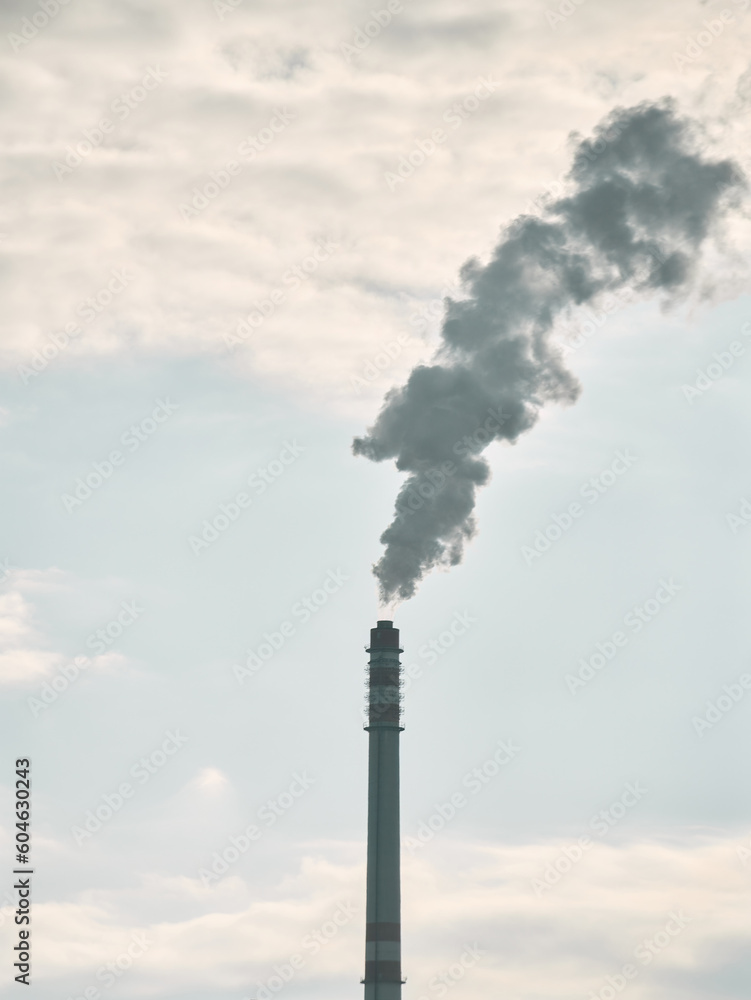 Smoke from a chimney against a blue sky Smoke from a chimney against a blue sky