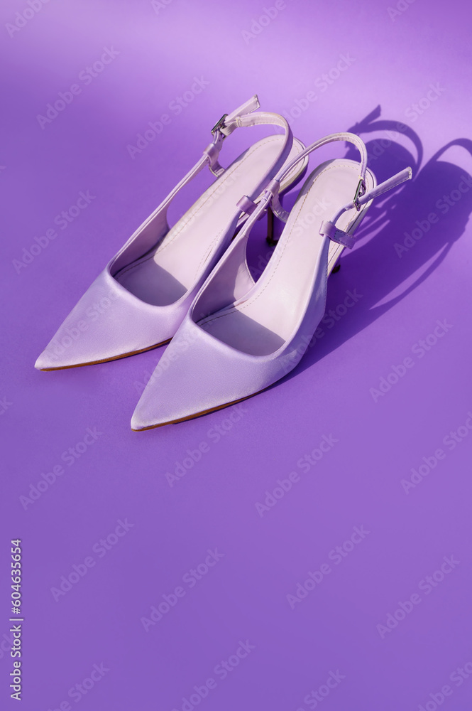 violet shoes of fashionable color on a violet background. Fashion shoes in Very Peri colors. Purple accessories. place for text violet shoes of fashionable color on a violet background. Fashion shoes in Very Peri colors. Purple accessories. place for text