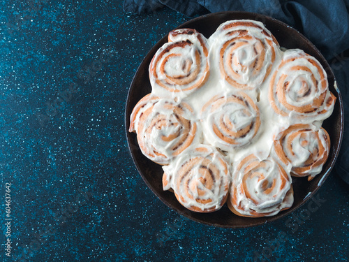 Vegan cinnamon rolls with topping, top view photo