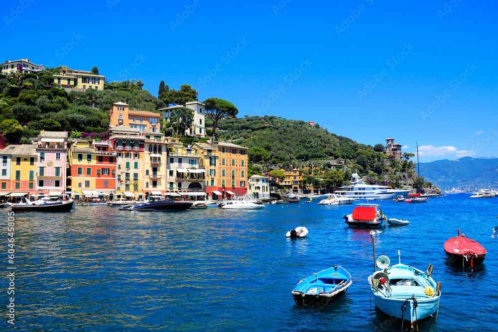 Portofino, Italy. Colorful buildings and boat filled Mediterranean Sea.