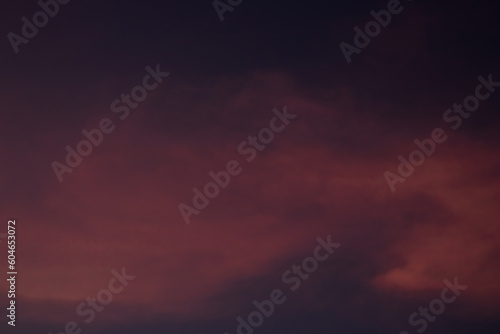 Dramatic sunset sky with dark clouds