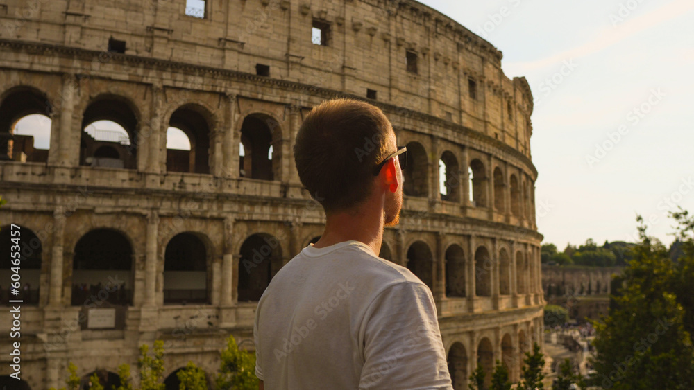 Man enjoying sunset at the Colosseum in Rome, Italy