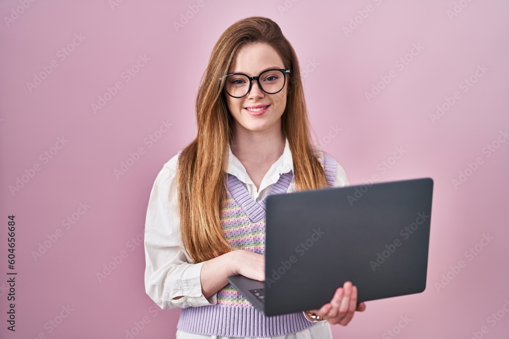 Young caucasian woman working using computer laptop with a happy and cool smile on face. lucky person. Young caucasian woman working using computer laptop with a happy and cool smile on face. lucky person.