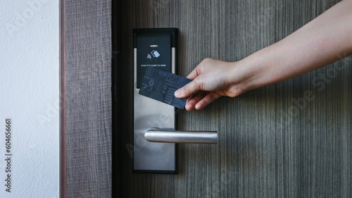 Smart card door key lock system in hotel. Hotel electronic lock on wooden door. Entrance door with electronic card lock security. Digital door lock security systems for access protection of hotel photo