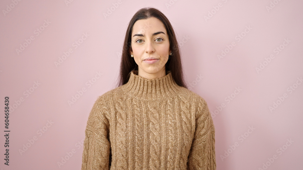 Young beautiful hispanic woman standing with relaxed expression over isolated pink background Young beautiful hispanic woman standing with relaxed expression over isolated pink background