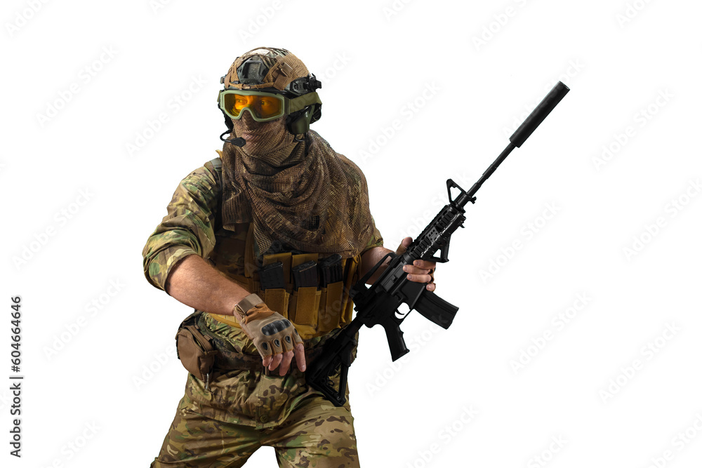 Special Mercenary soldie during a special operation walks with an automatic rifle and looking by side. Special Mercenary soldie during a special operation walks with an automatic rifle and looking by side.