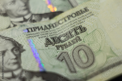 TIRASPOL, TRANSNISTRIA - MARCH 1, 2023: Selective blur on banknotes of 10 transnistrian rubles. it is the official currency of the unrecognized state of Transnistria. photo