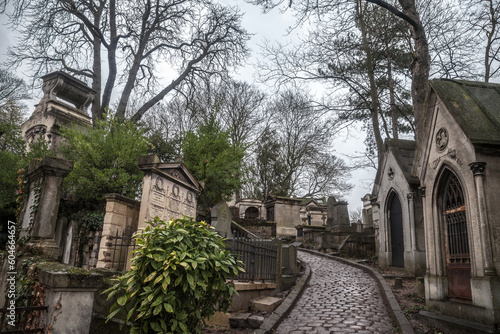 PARIS  FRANCE - DECEMBER 22  2017  Graves from the 19th century in Pere Lachaise Cemetery in Paris  France  during a cold cloudy winter afternoon. Pere Lachaise Cemetery is the largest cemetery in Par