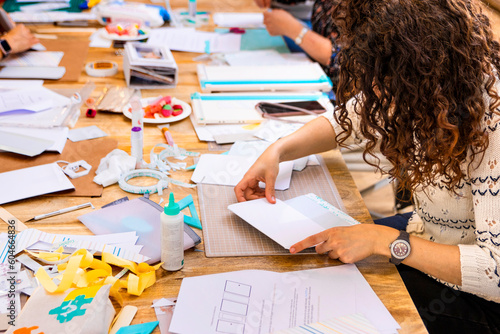 Fotografija Scrap Booking Workshop. Close-up of a woman working on paper.