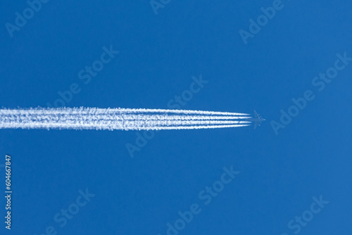 Airplane aviation airport contrail the blue sky high. © aapsky