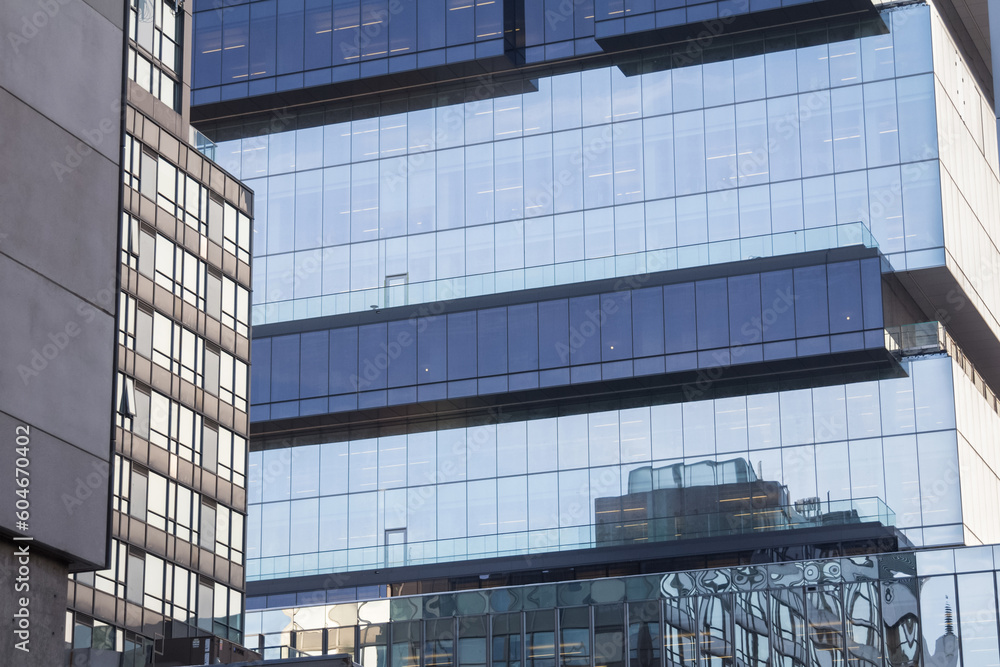 Fototapeta premium Skyscrapers reflecting in the mirror like windows of another modern high rise in Toronto, Ontario, Canada