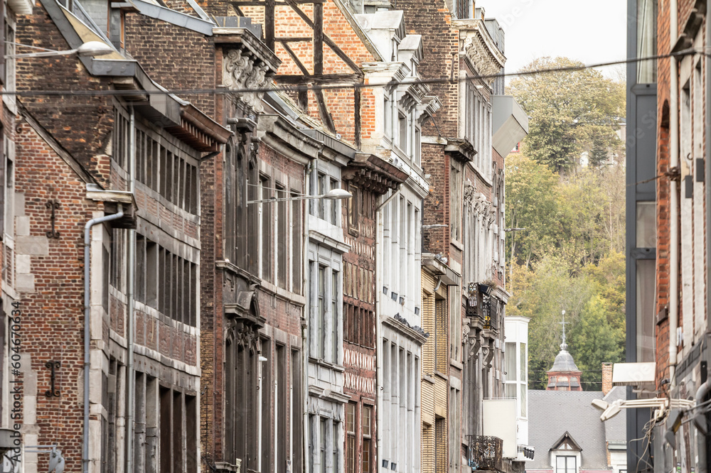 Medieval brick and stone facades in the city center of Liege, Belgium, belonging to residential urban buildings.