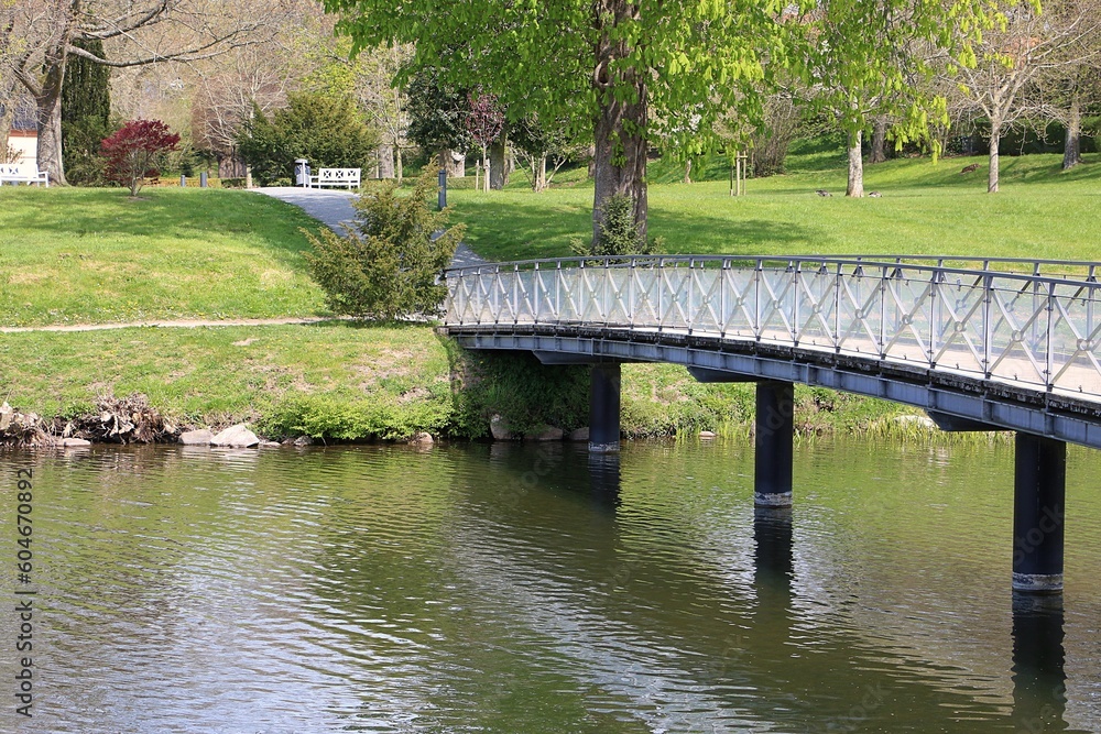 romantic small bride over a small river in the park romantic small bride over a small river in the park